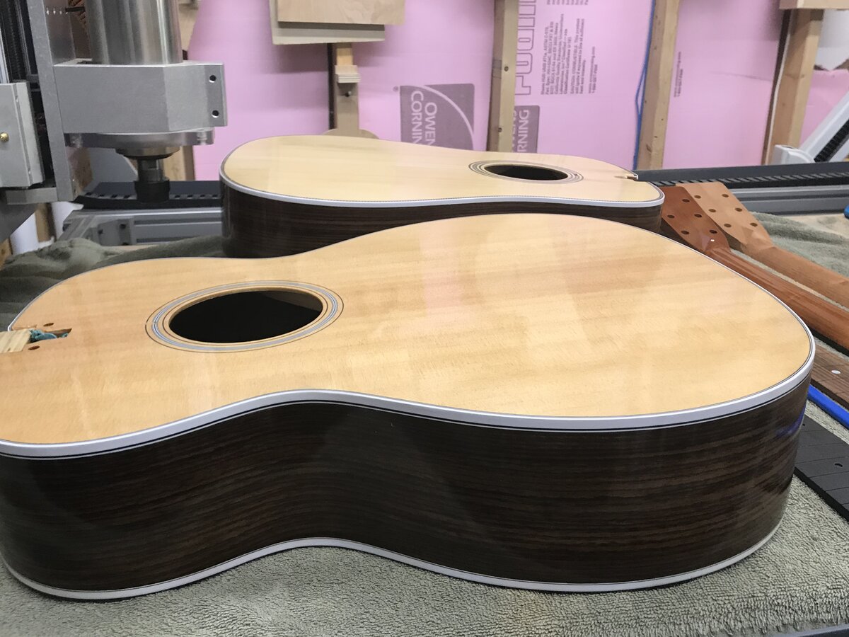 Two guitar bodies side by side