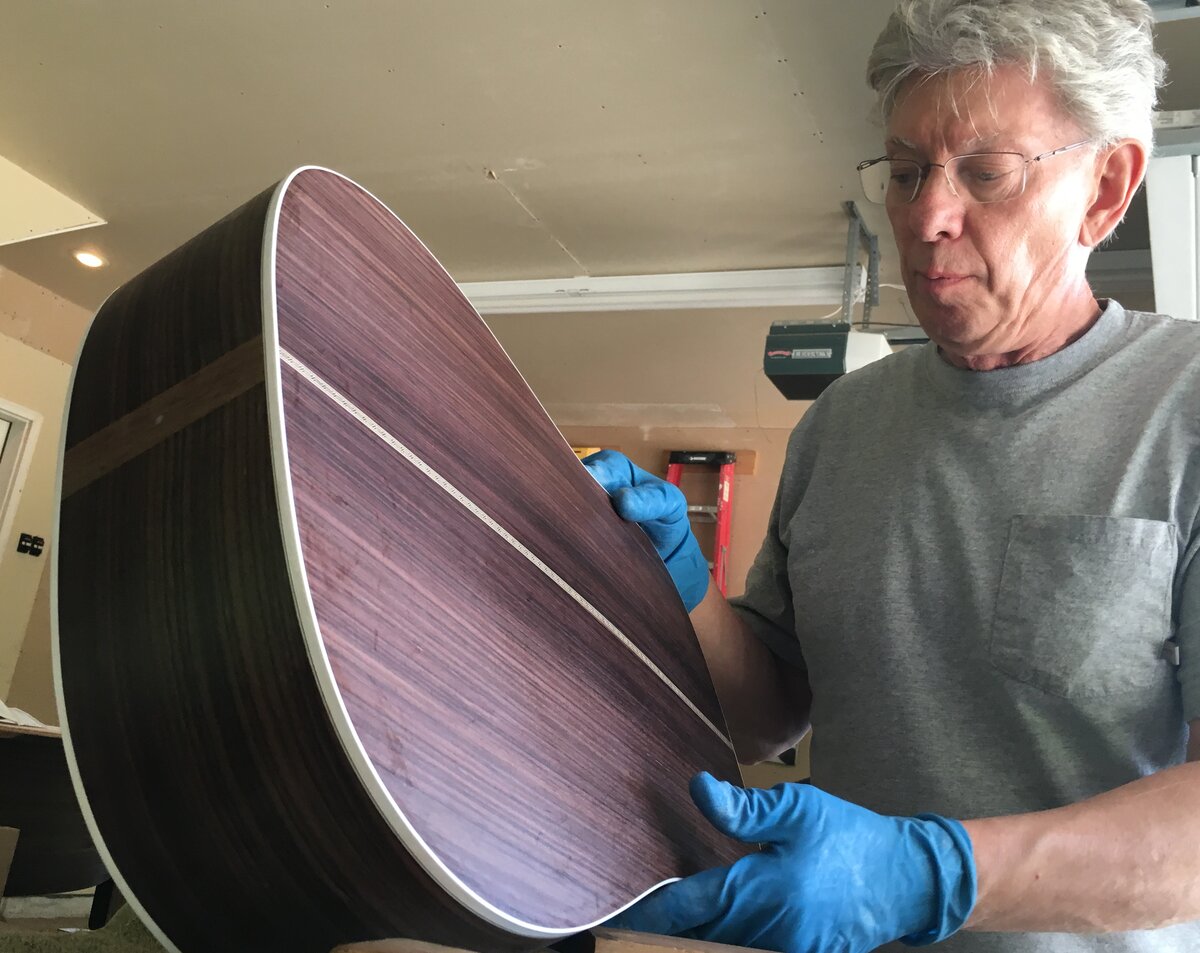 Dan inspecting a rosewood body